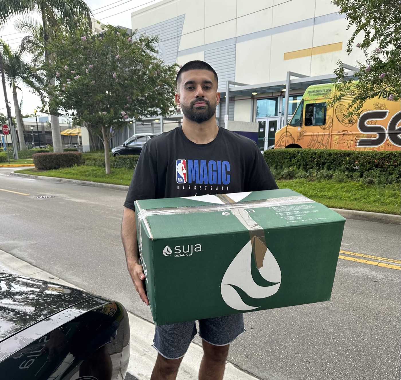 A case of Suja Organic juice being delivered